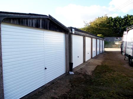White Hormann 2002 steel up and over garage doors. Double and single size.